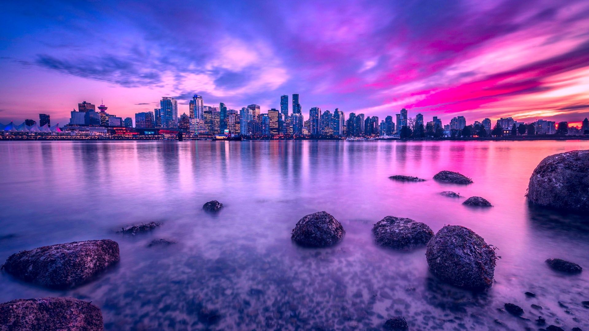 Vancouver skyline at sunset with purple sky — Work in Canada Immigration